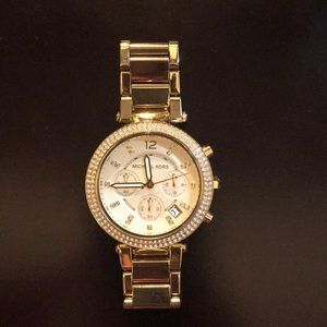 Gold Michael Kors watch with crystals around face